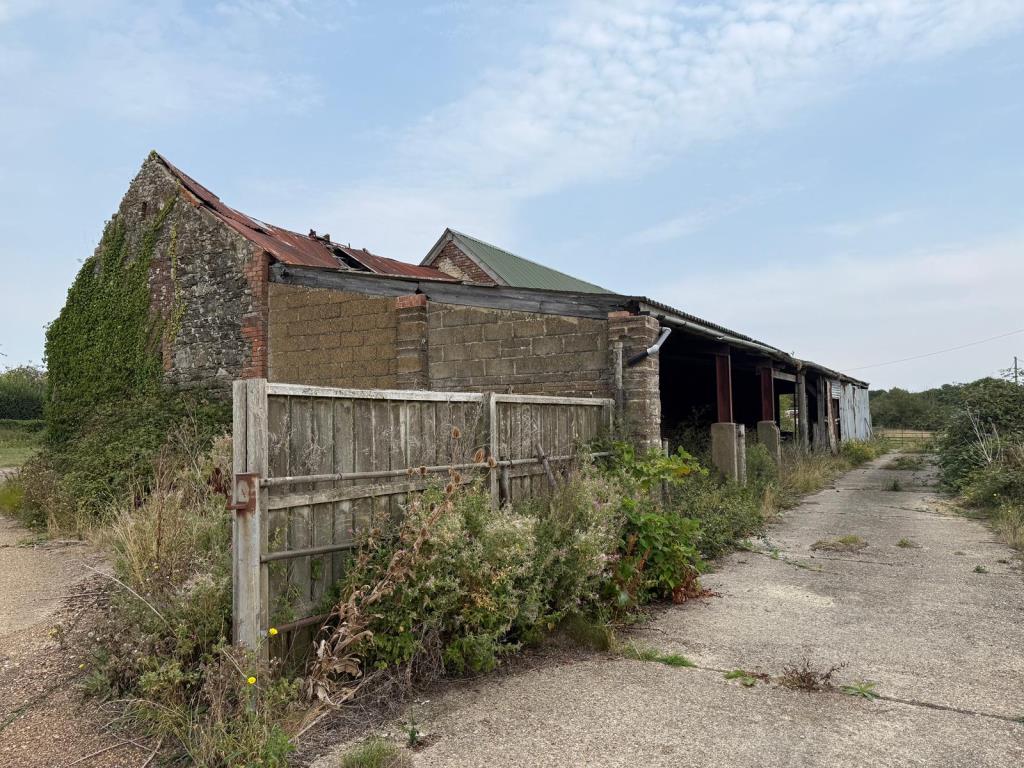 Lot: 173 - TRADITIONAL FARMHOUSE FOR REFURBISHMENT AND BARN WITH PLANNING FOR RESIDENTIAL CONVERSION - APPROXIMATELY 17.5 ACRES - View of barn with concrete hardstanding area